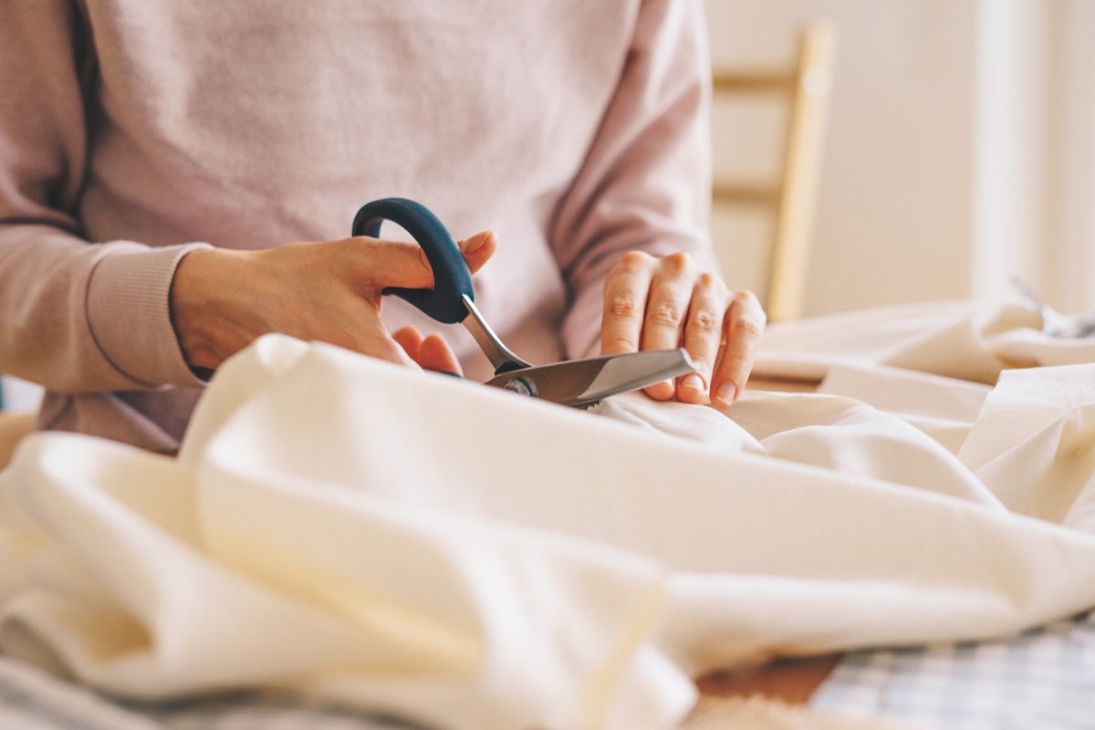 Cutting fabric with dressmaking scissors